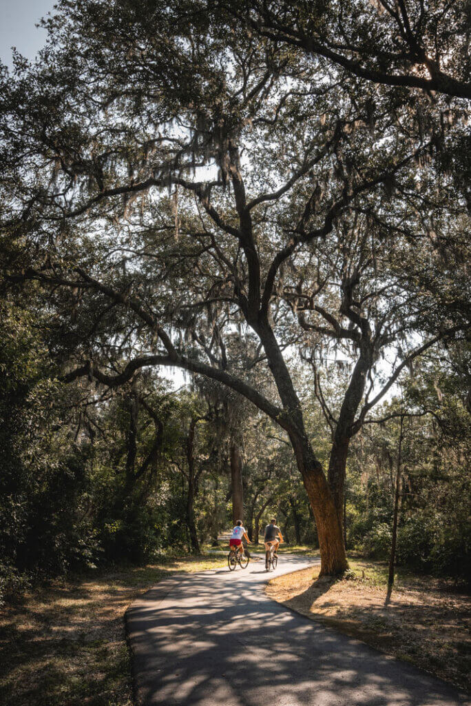 Megan and Scott biking at Hugh S. Branyon Backcountry Trail at Gulf Shores State Park in Alabama
