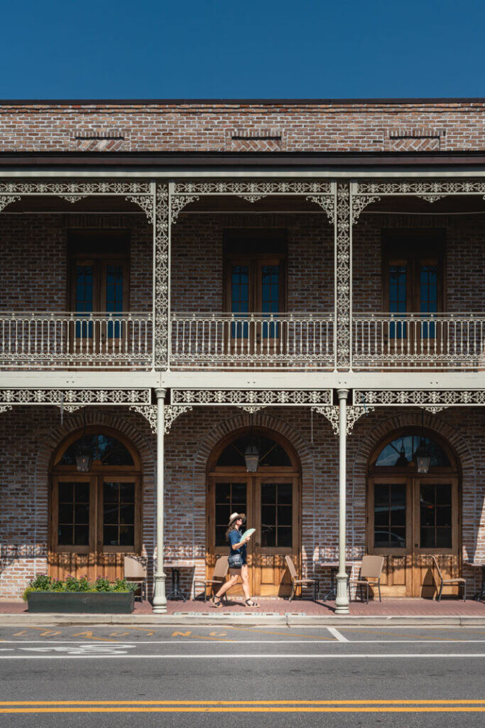 Megan walking through the Fairhope French Quarter in Fairhope Alabama