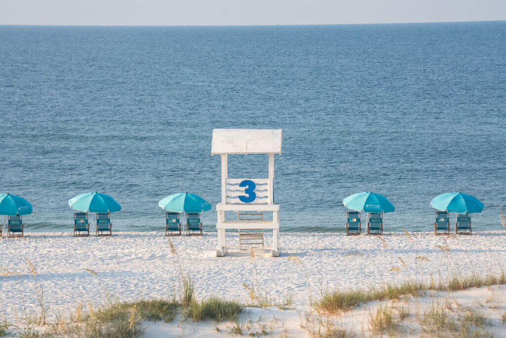 white sand beach and lifeguard tower at Gulf State Park in Gulf Shores Alabama