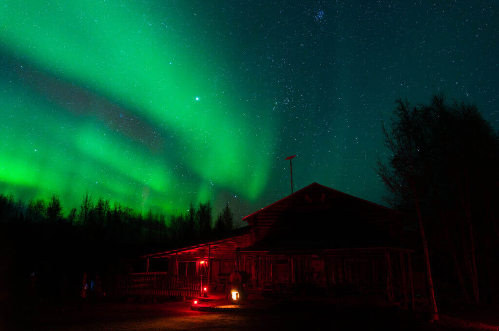 aurora borealis at Arctic Trading Post formerly Wildwood General Store on the Elliott Highway in Alaska with Northern Alaska Tour Company