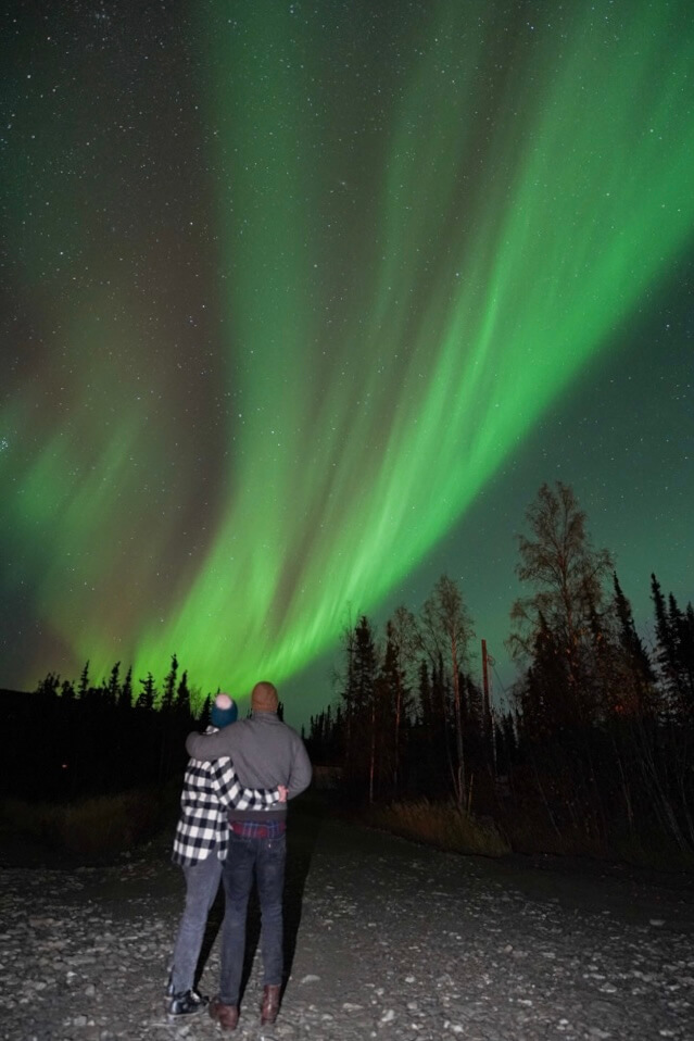 Megan and Scott looking at the northern lights aurora borealis in Fairbanks Alaska