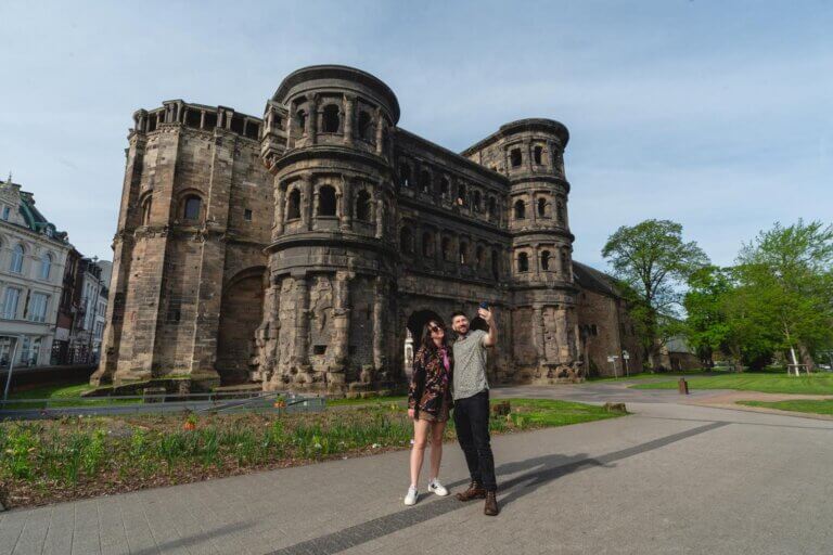 Megan and Scott taking a selfie at the Porta Nigra Gate in Trier Germany