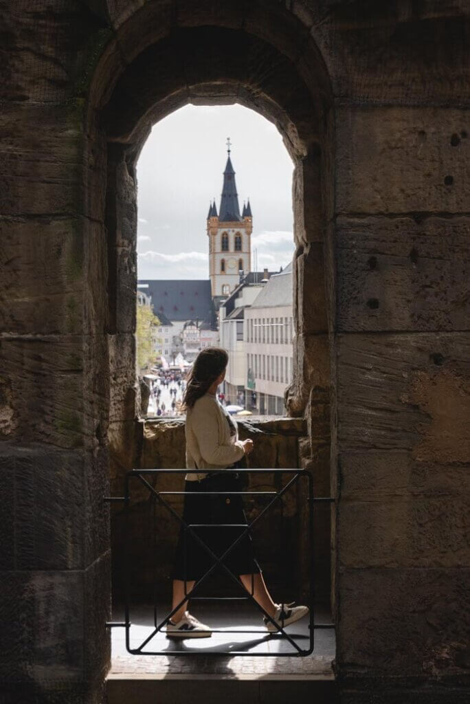 Megan walking through a view of Trier from the upper level of the Porta Nigra Gate in Germany