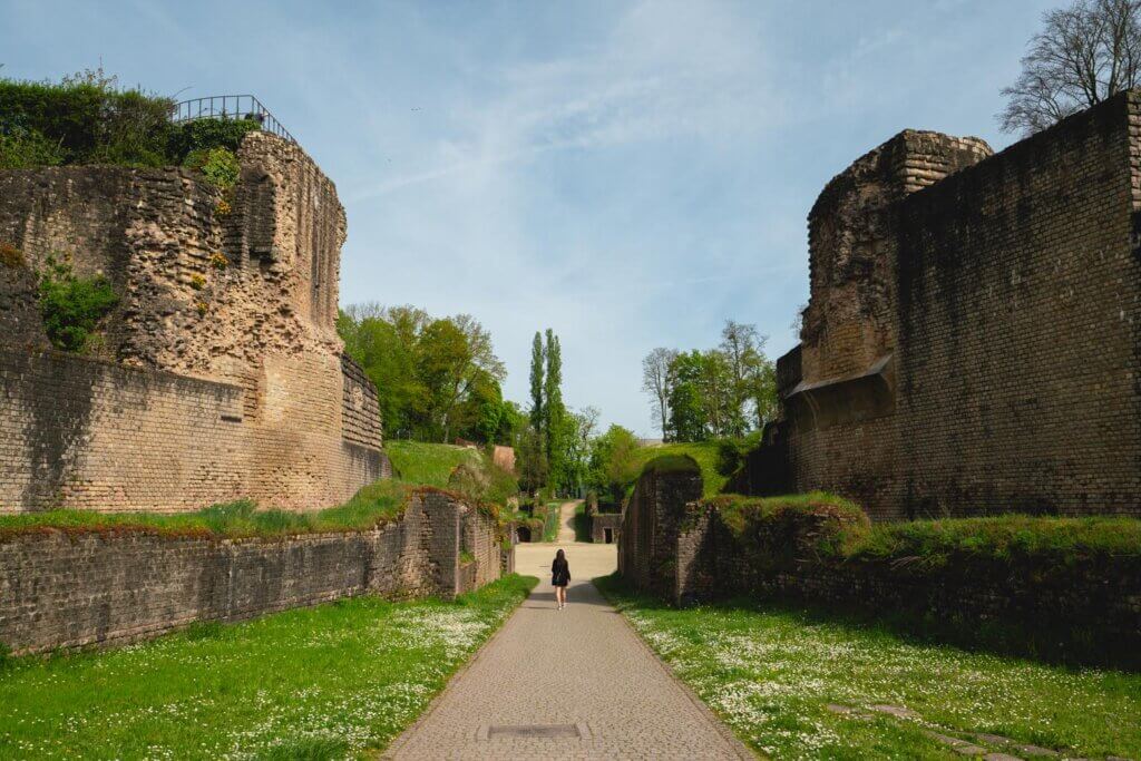Megan walking through the Trier Ampitheater Roman Ruins in Germany