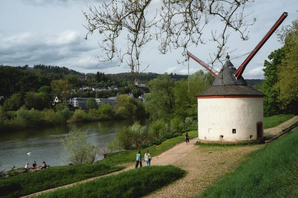 a walk along the Moselle with a view of alter krahnen in Trier Germany