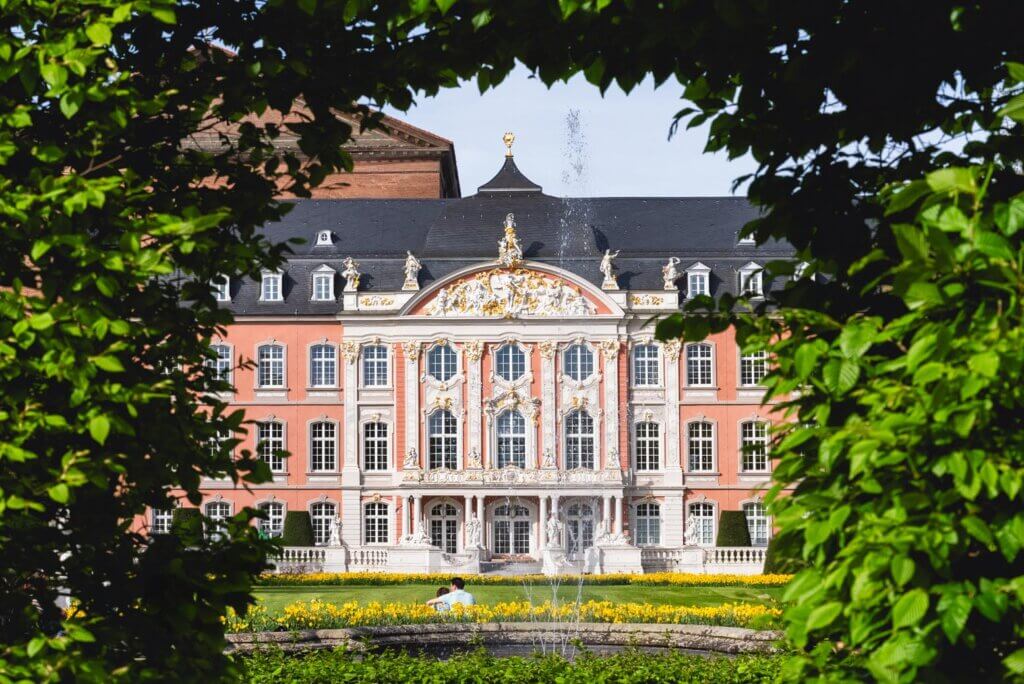 couple enjoying the views of the Electoral Palace a Rococo gem in Trier Germany