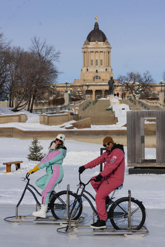 Megan and Scott ice biking on Nestaweya River Trail in Winnipeg in winter