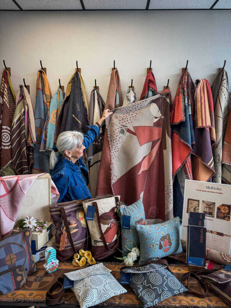 Margaret-Wheeler-showing-a-Chickasaw-blanket-at-Mahota-Textiles-in-Sulphur-Oklahoma
