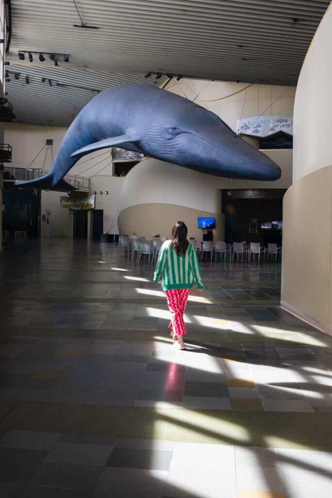 Megan walking through the entrance of the Aquarium of the Pacific in Long Beach California