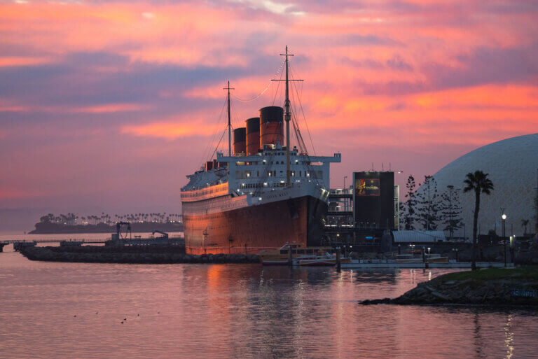 view of the Queen Mary at Sunset in Long Beach California