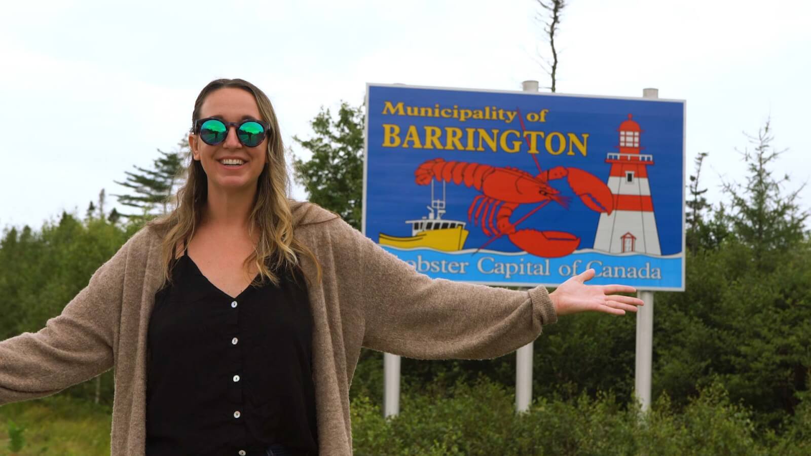 Megan in front of the Barrington Lobster Capital of Canada sign