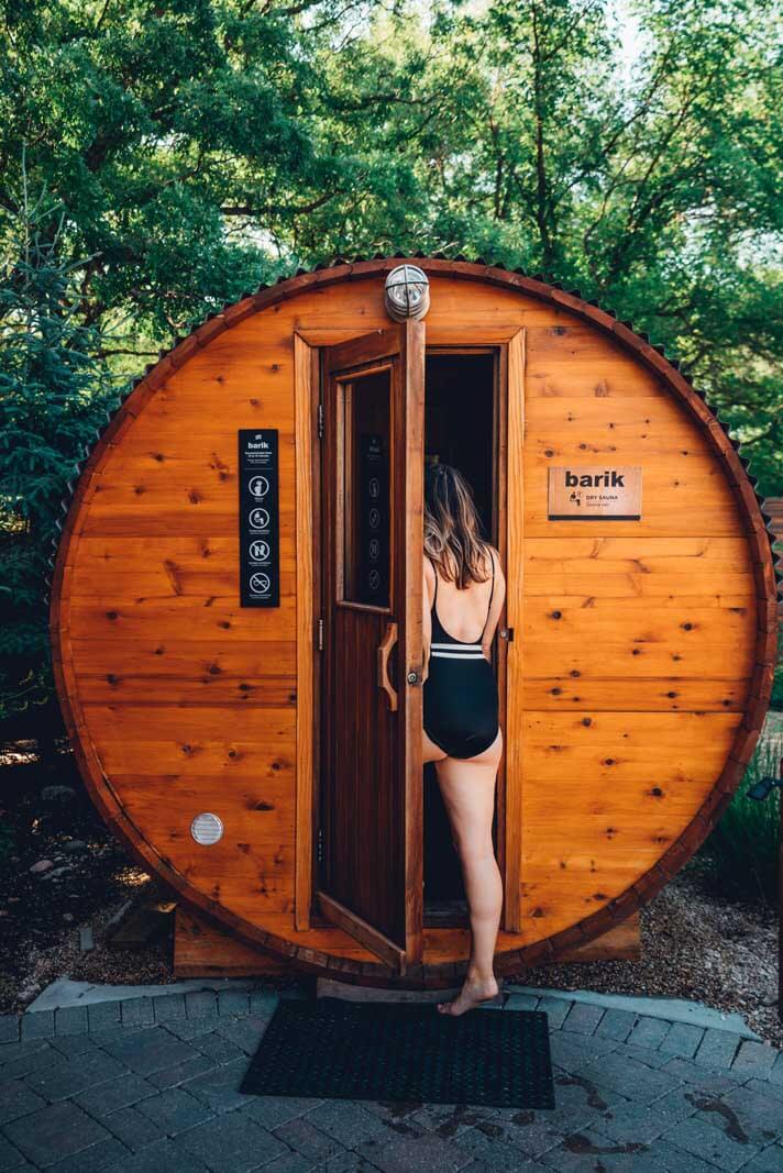 Megan walking into a sauna at Thermea nordic spa in winnipeg