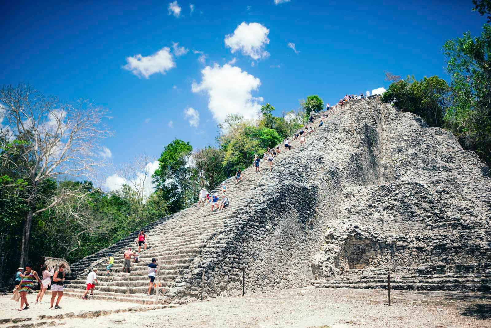 People climbing Coba Ruins