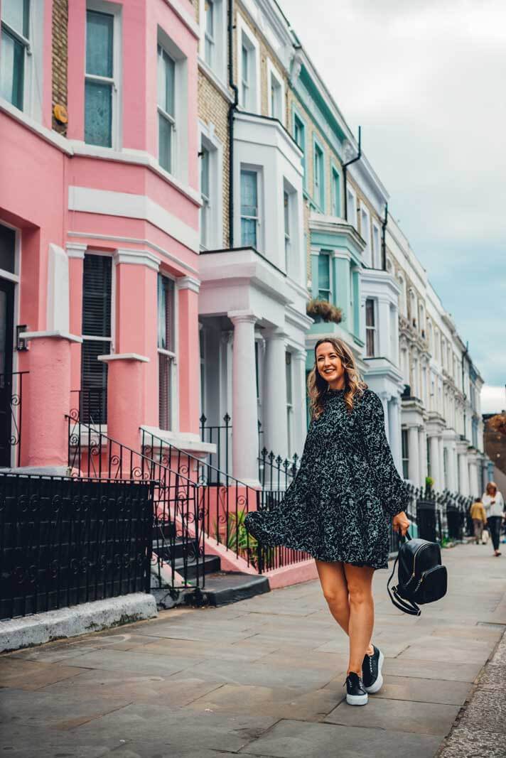 Megan by the pastel row of homes in Notting Hill London