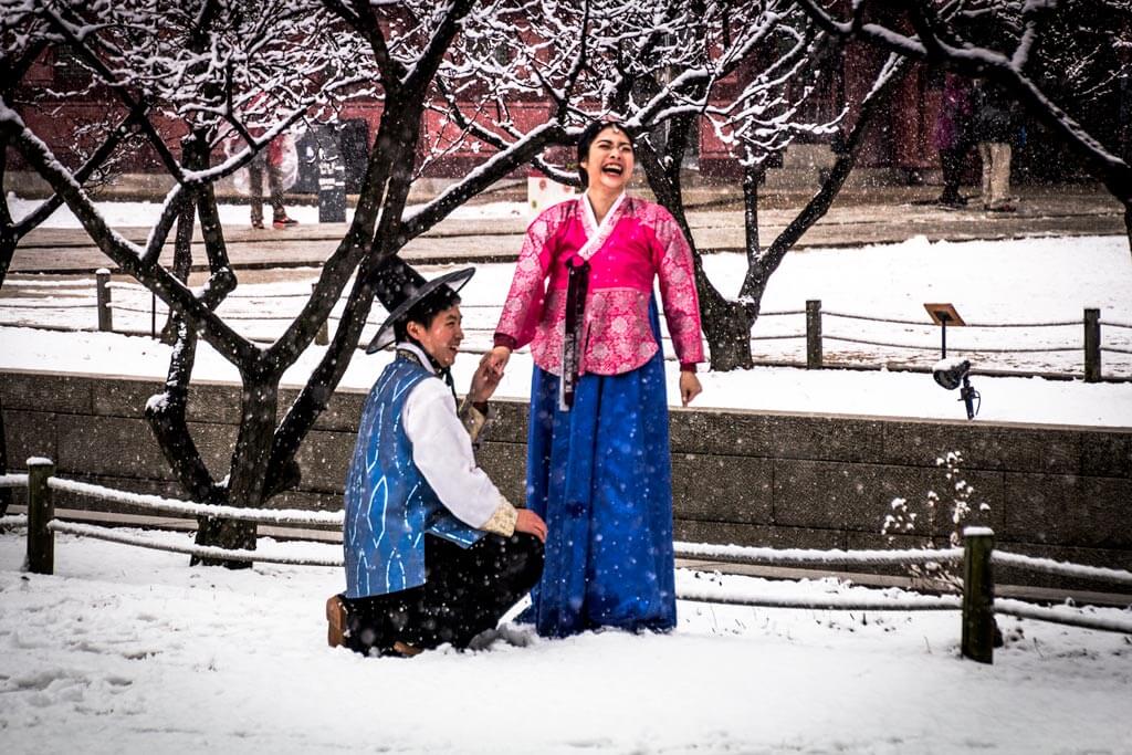 Couple Laughing During Professional Shoot at Gyeongbokgung Palace during snow