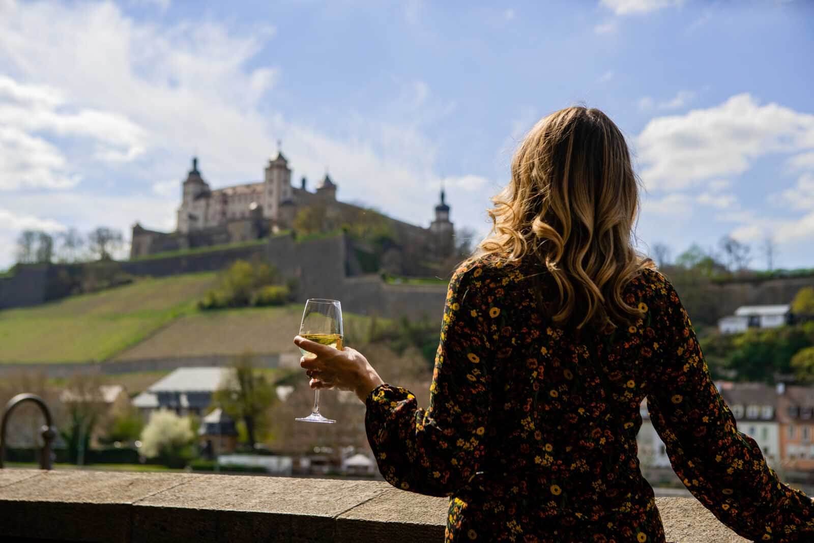 Megan enjoying a glass of wine on the old main bridge in Würzburg Germany