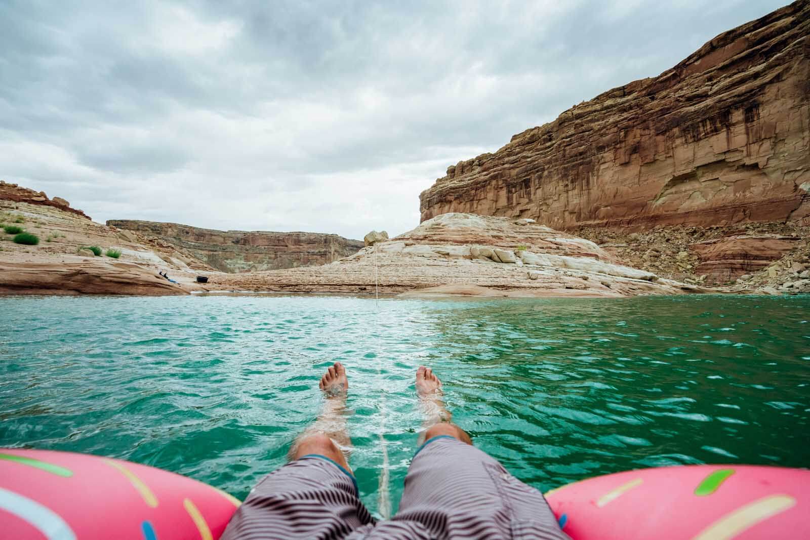 Scott floating around Lake Powell on a donut