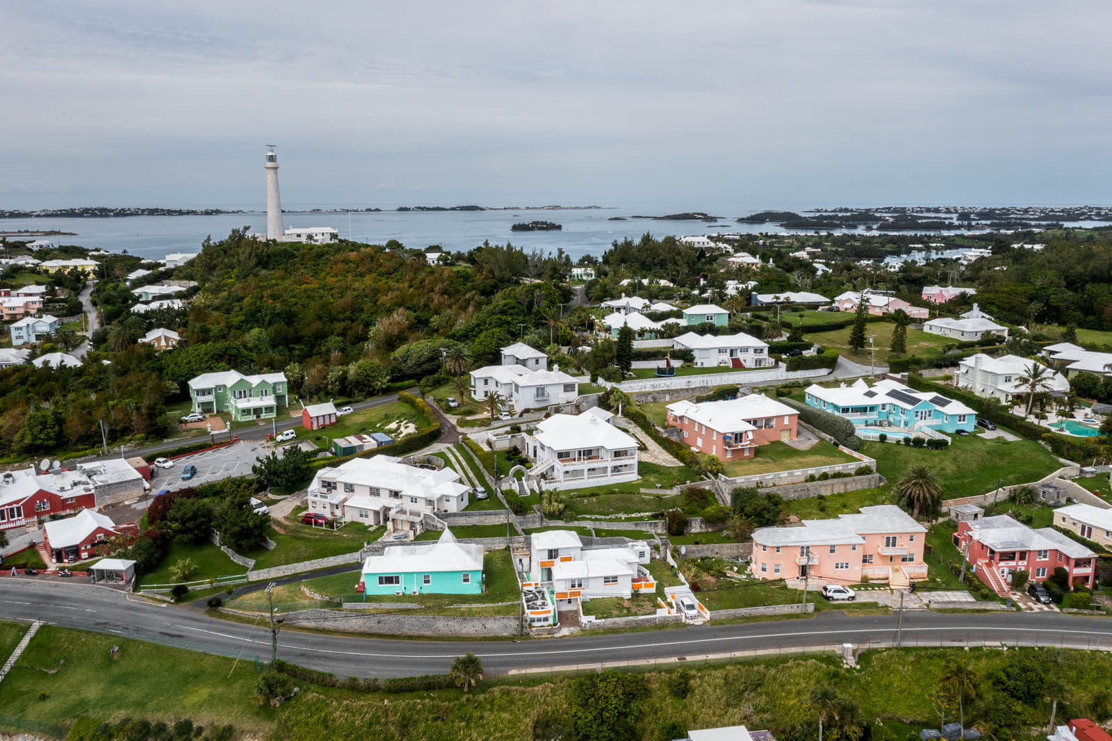 Gibb's Lighthouse from Sinky Bay with Colorful Homes in Bermuda