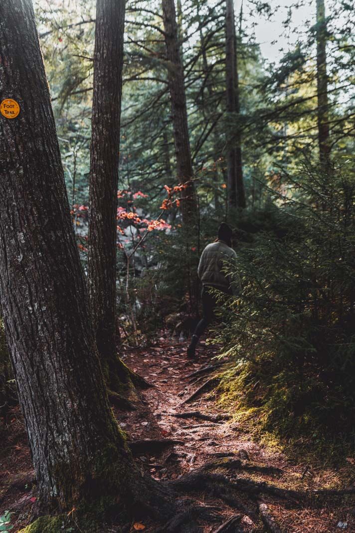 Hiking around Lake Sagamore on aan Adirondacks road trip in Upstate New York in the Fall