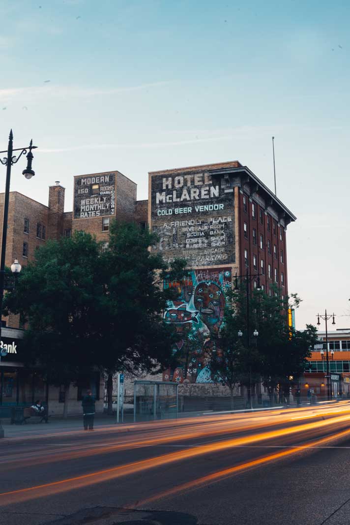 Cars going by Hotel McLaren in the Exchange District in WInnipeg