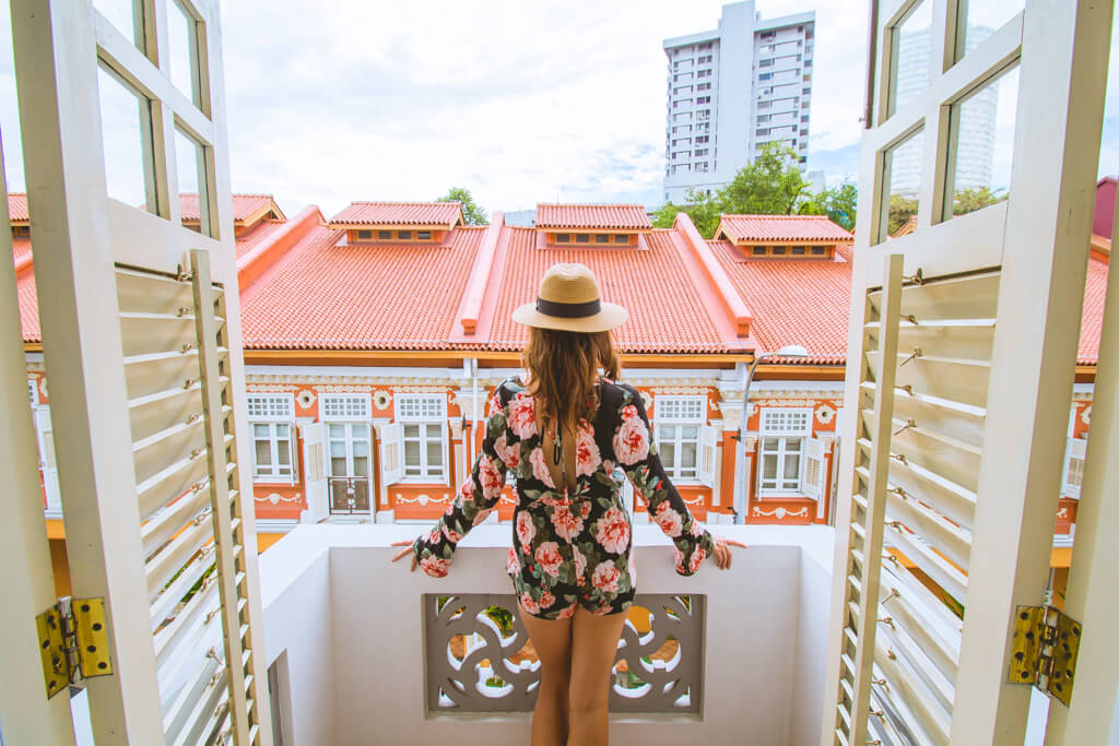 Megan looking at the view from our balcony at Hotel 1929 in Singapore