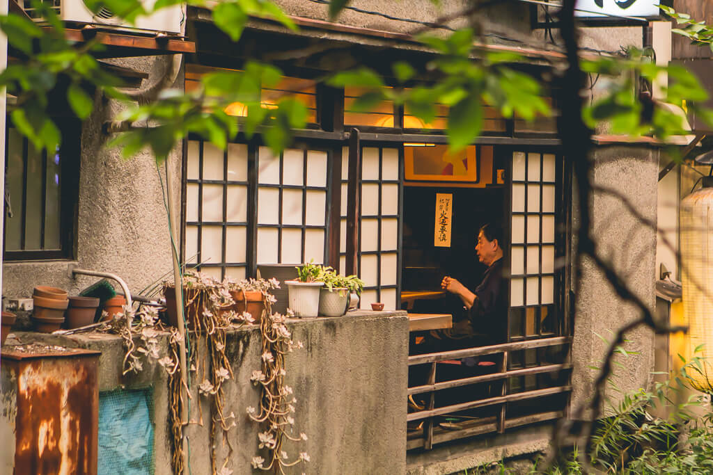 Man in window at kawaramachi kyoto