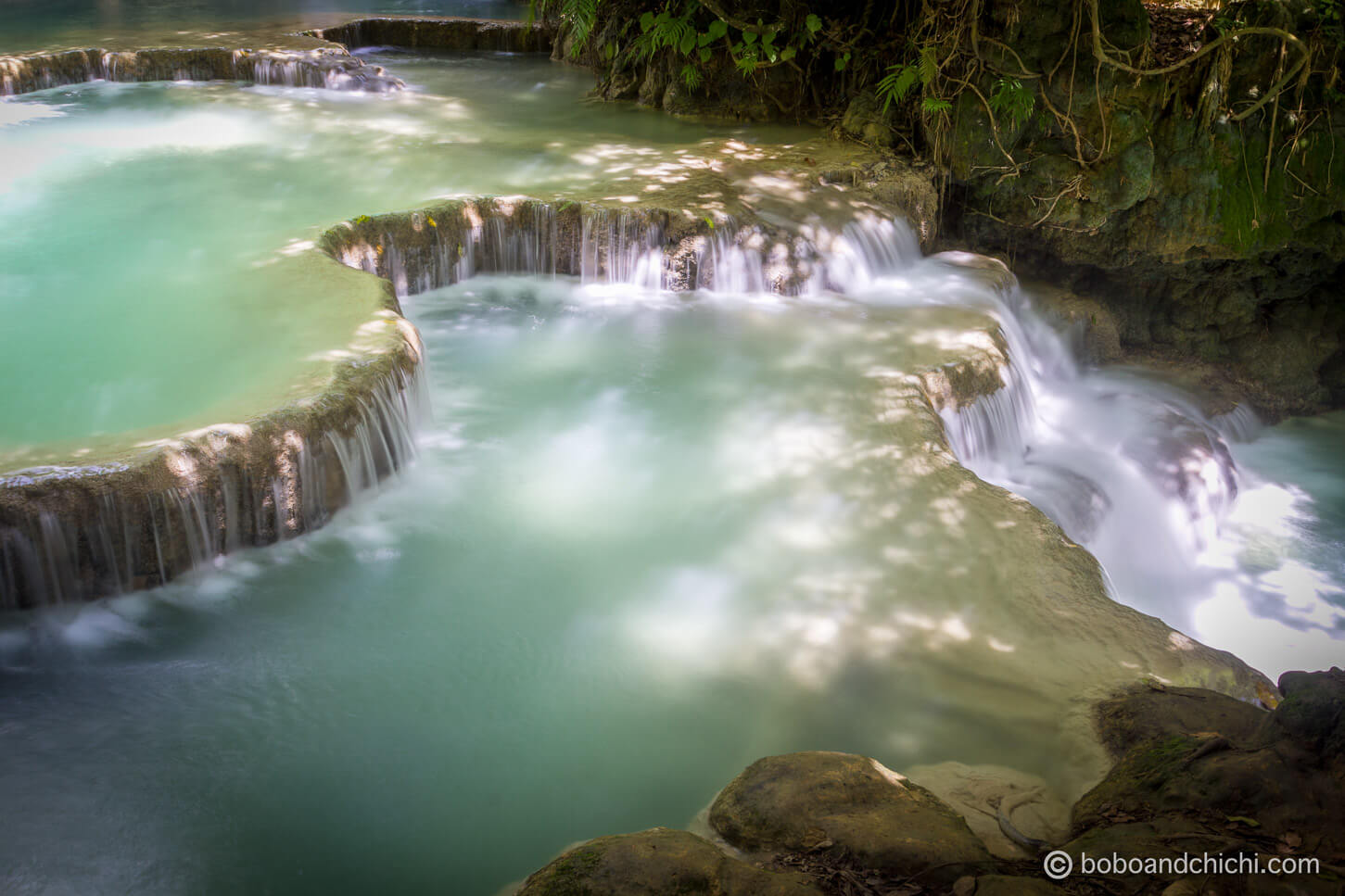 Cascading waterfalls at Kuangsi Waterfall