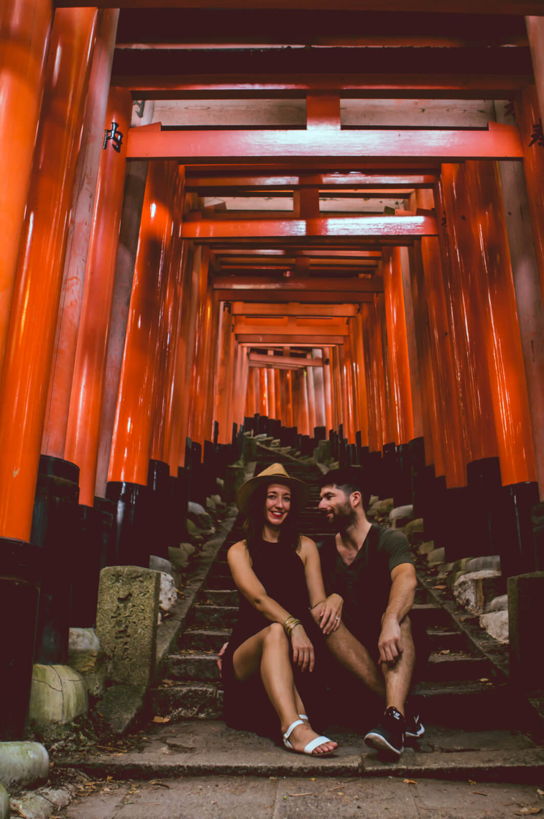 Couple posing at Fushimi Inari Tori Gates