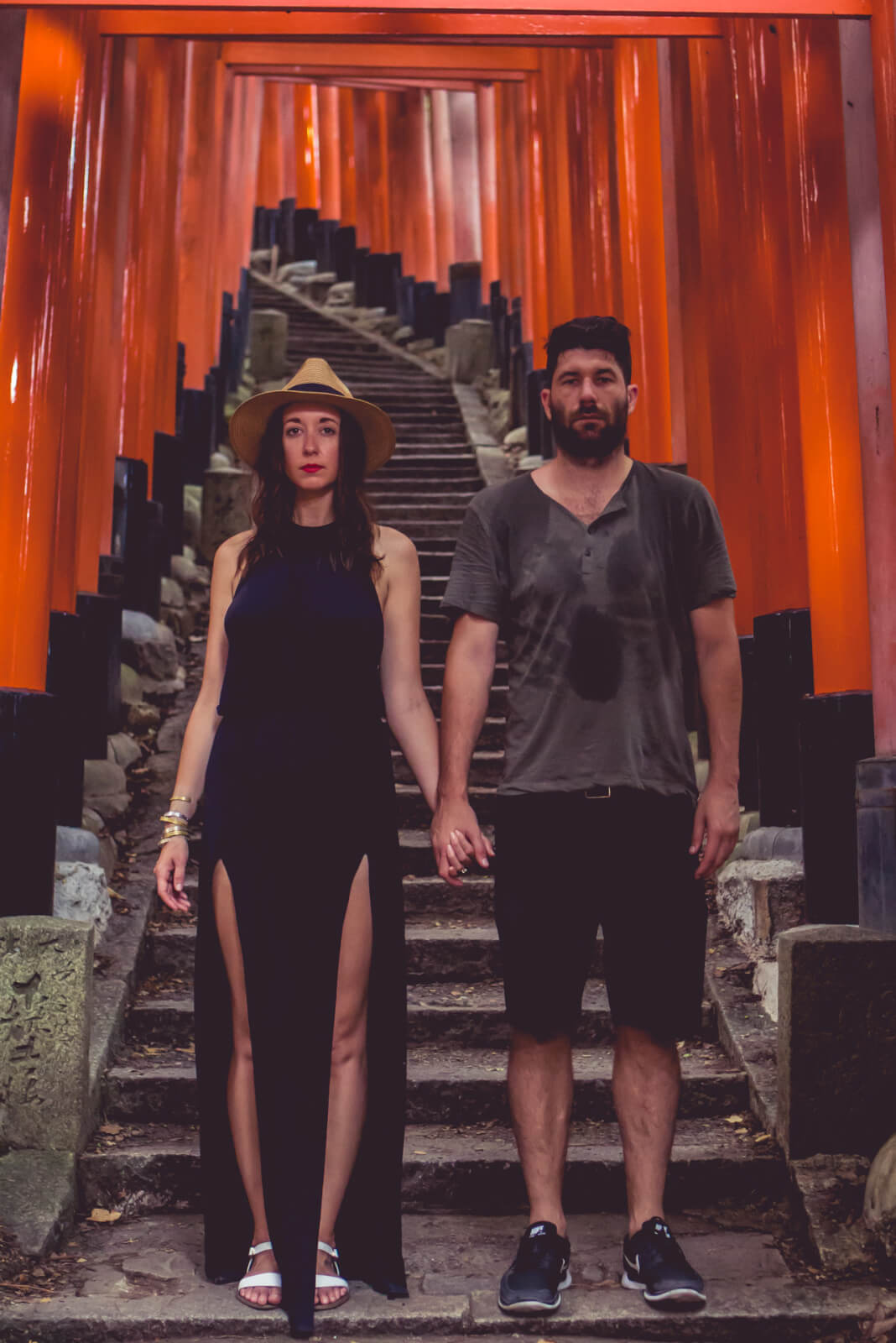 Couple posing at Fushimi Inari Tori Gates