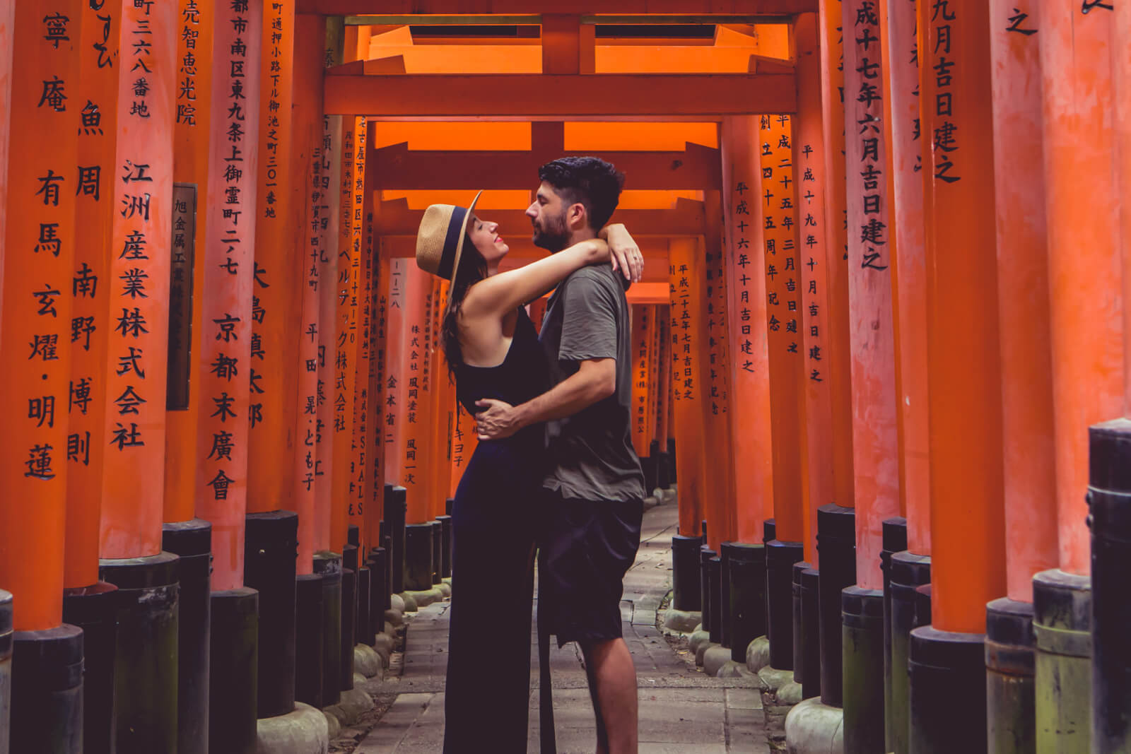 Couple posing at Fushimi Inari Tori Gates