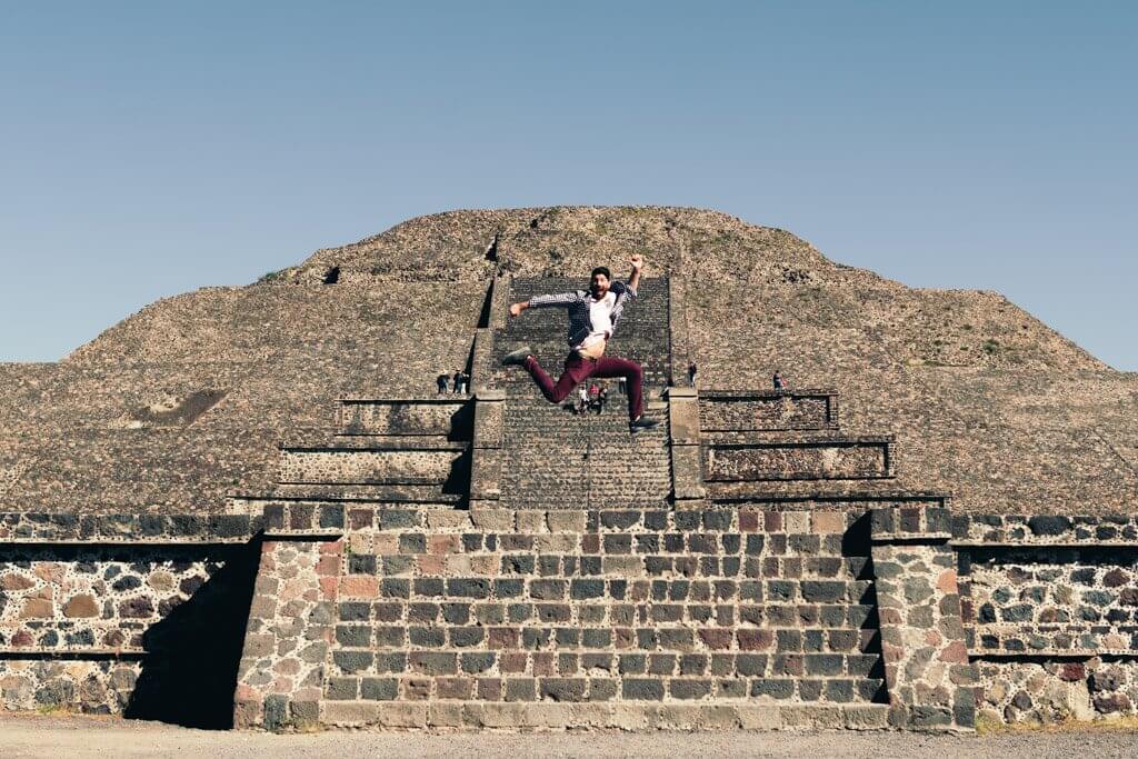 Jumping in front of Pyramid of the Moon Teotihuacan Mexico City