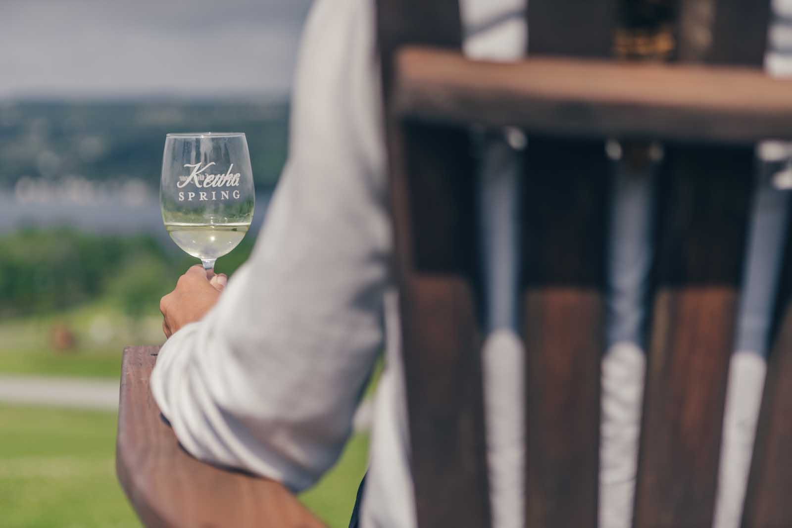 Megan with a glass of wine at Keuka Sprnig Winery in Finger Lakes