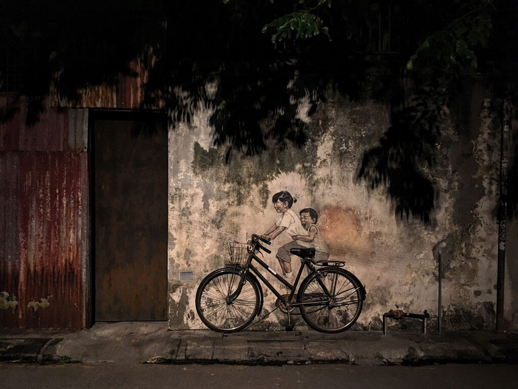 famous Penang street art -- little girl and boy on a bicycle