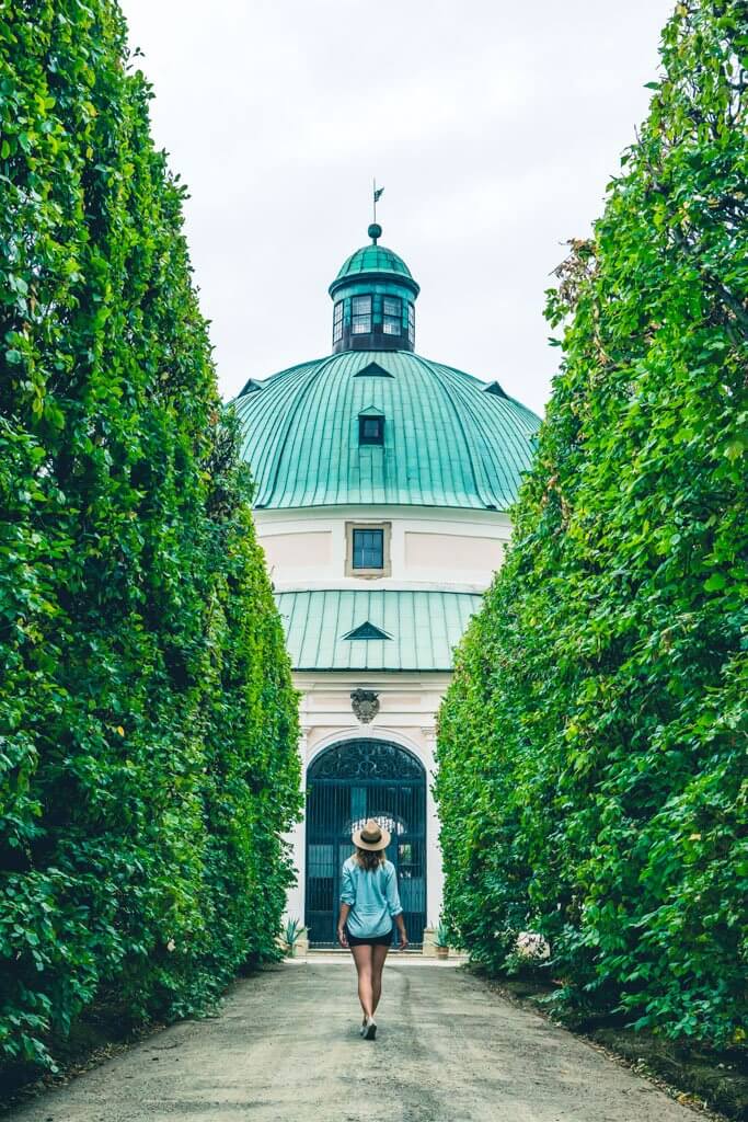 Megan walking through the castle gardens in Kromeriz Czech Republic towards the rotunda