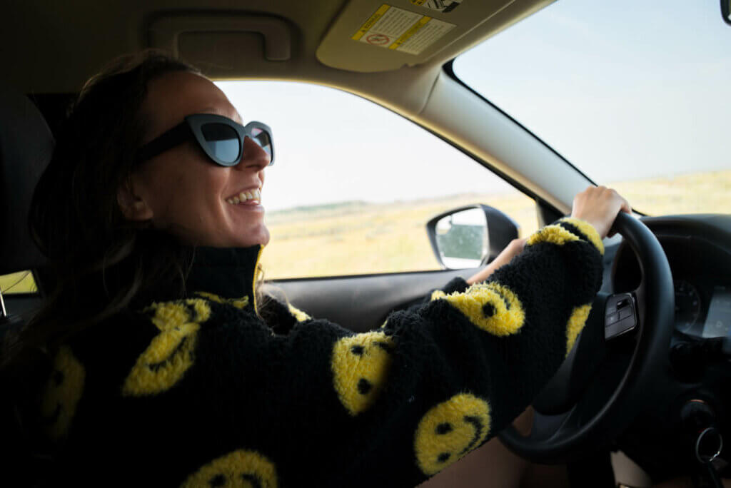 Megan Driving on the Badlands Parkway in Grasslands National Park East Block in Saskatchewan Canada