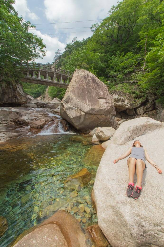 Megan lying on the Biseondae Rocks in Seoraksan National Park in Korea