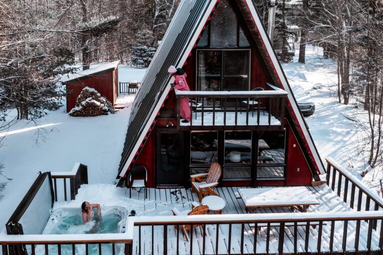 Megan and Scott enjoying their Southern Vermont winter vacation in an a frame cabin in dover vermont