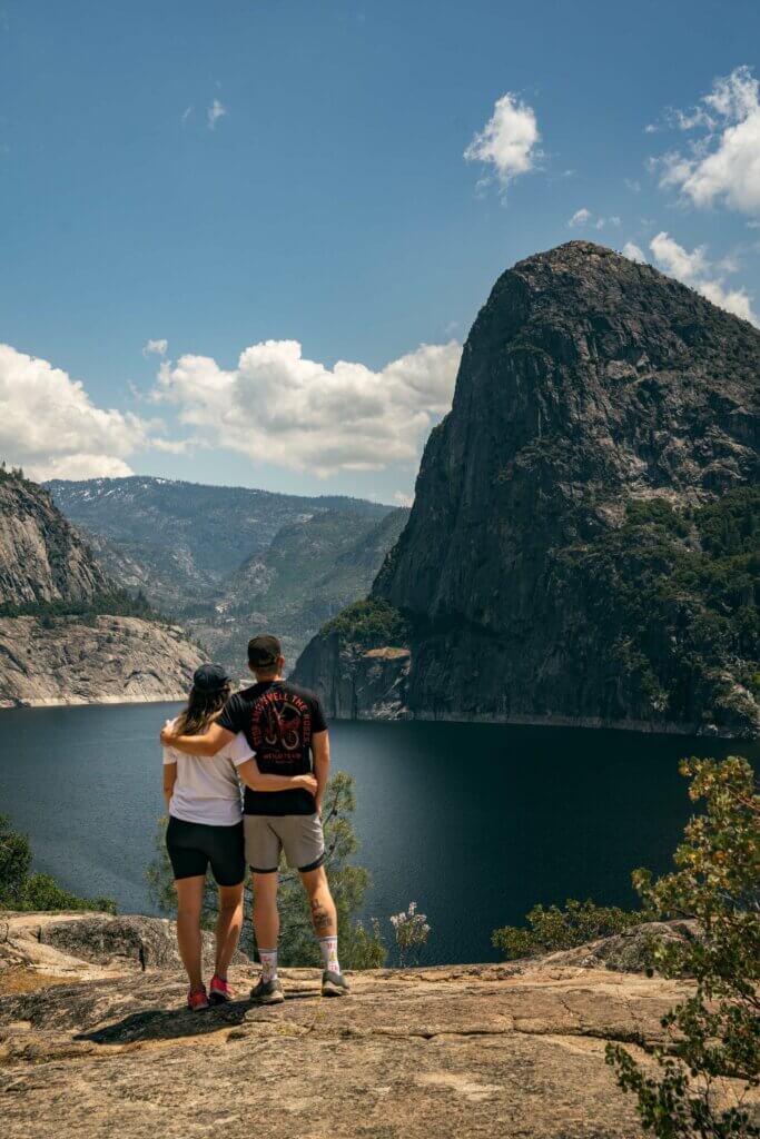 Megan and Scott looking at the view of Kolana Rock at Hetch Hetchy Valley in Yosemite National Park in California
