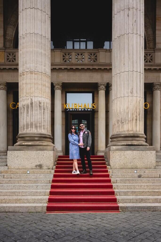 Megan and Scott walking down the red carpet at the Kurhaus in Wiesbaden Germany