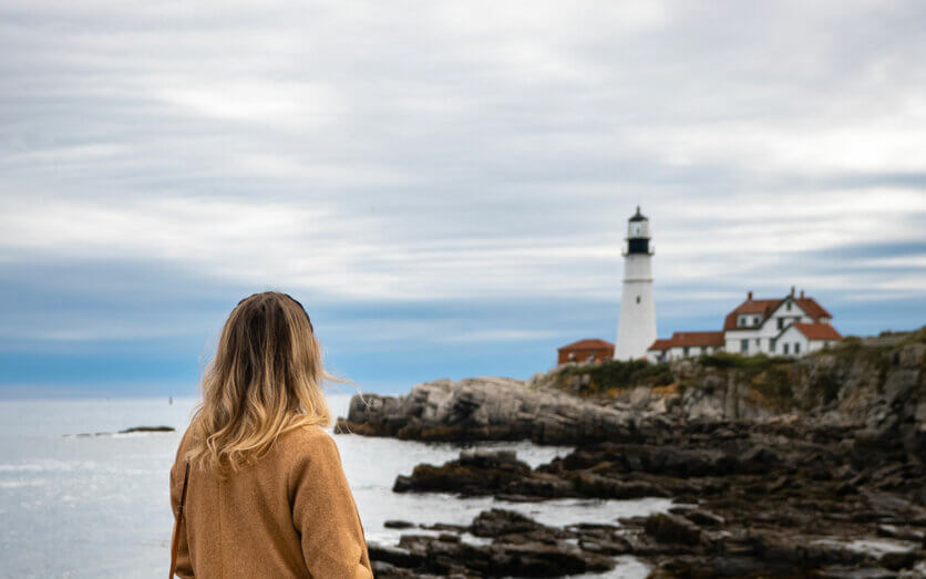 Megan-at-Portland-Head-Lighthouse-in-Maine-one-of-the-most-stunning-East-Coast-lighthouses