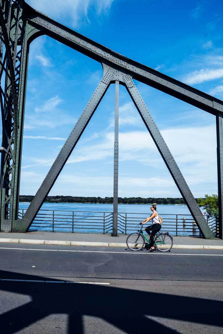 Megan biking across the Bridge of Spies