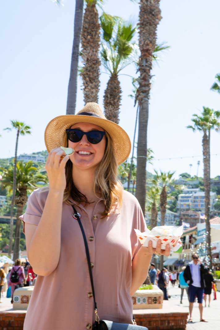 Megan eating food on the Catalina food tour in Avalon