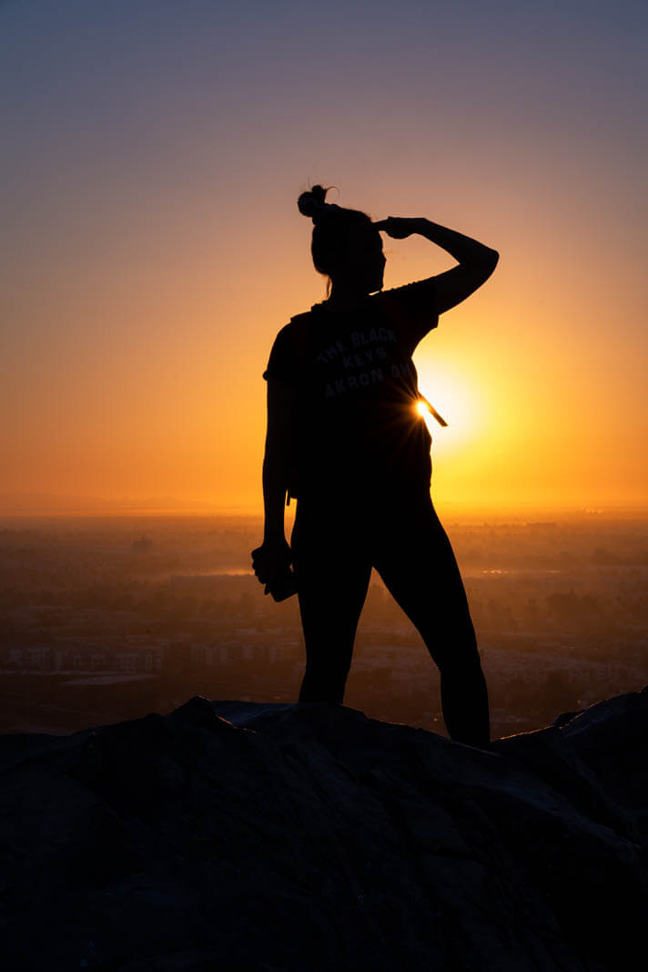 Megan enjoying the sunrise view from A Mountain aka Hayden Butte in Downtown Tempe Arizona