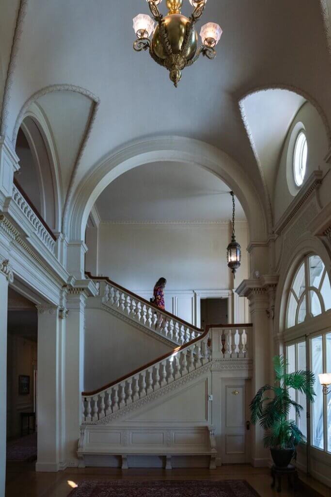 Megan going down the stairs inside Cairnwood Estate (Bryn Athyn Historic District) in Montgomery County PA