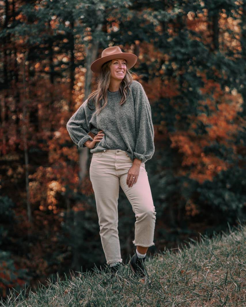 Megan in th fall wearing a pink hat in the finger lakes in new york