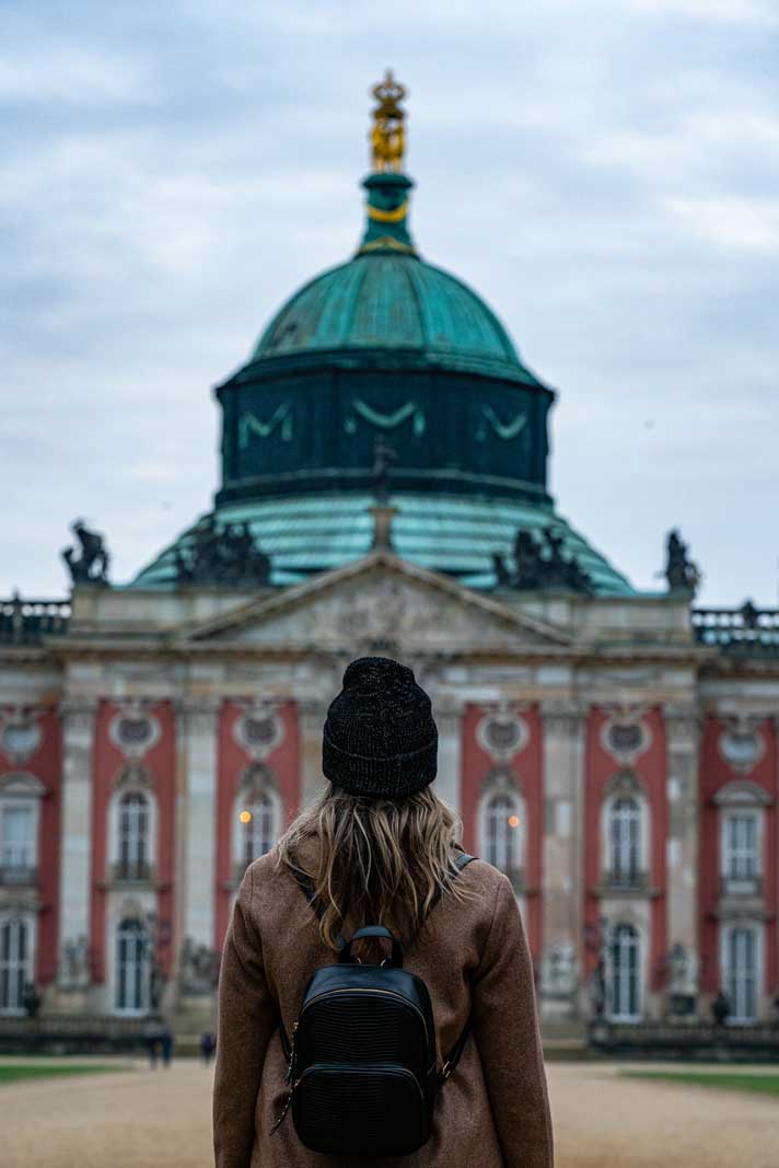 Megan looking at the New Palace in Potsdam in Sanssouci Park