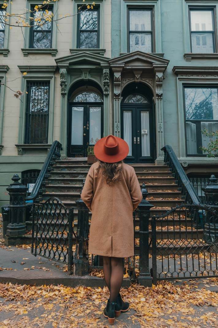 Megan looking at the brownstones in Park Slope Brooklyn