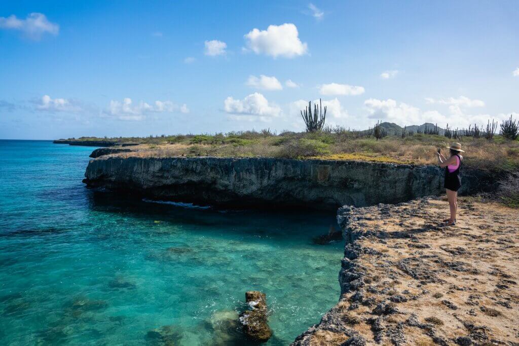 Megan looking at the cliffs at Bise Morto at Washington-Slagbaai National Park in Bonaire