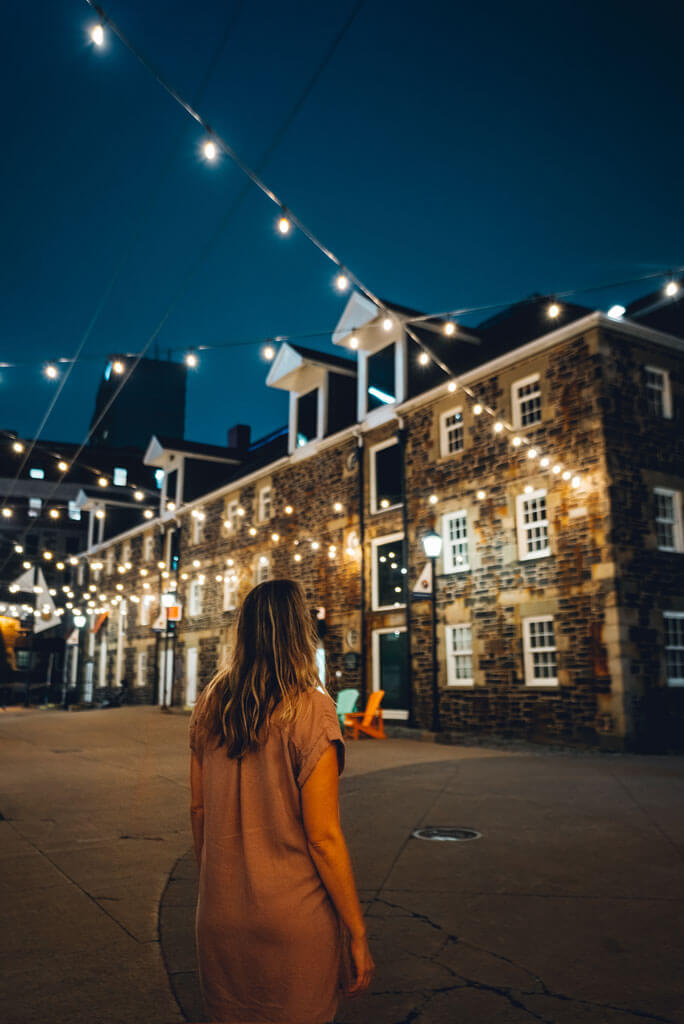 Megan looking at the lights at night in downtown Halifax