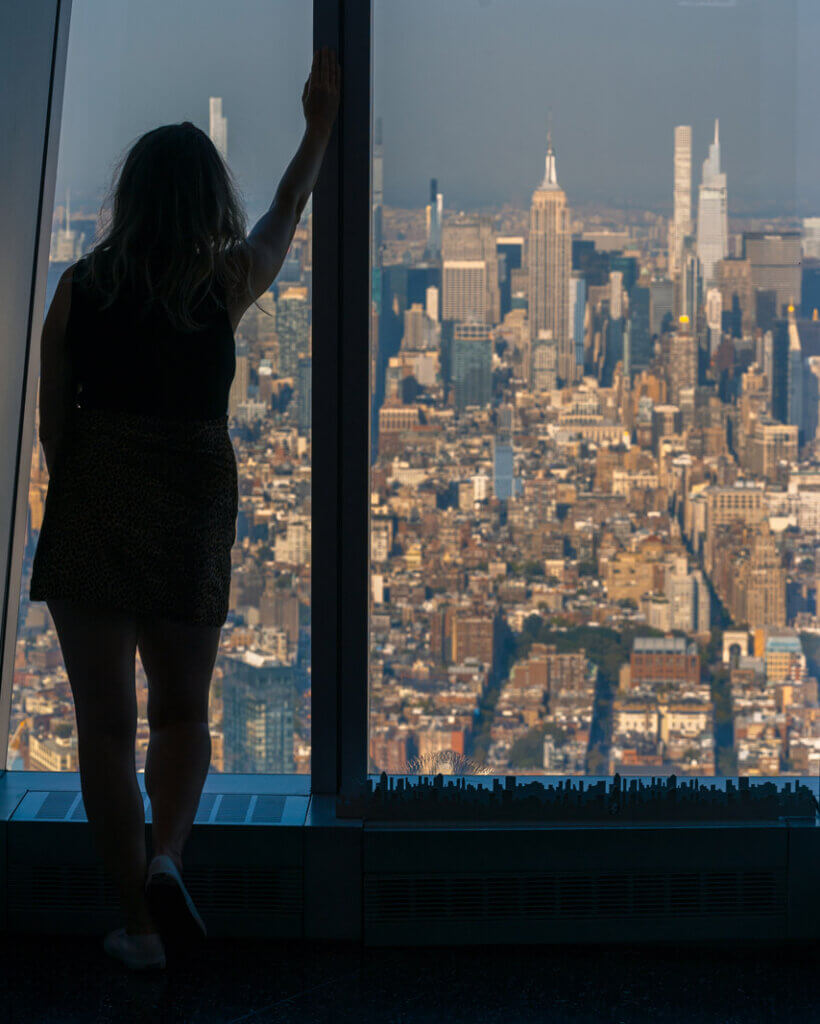 Megan looking out at the view from One World Observatory in Lower Manhattan NYC